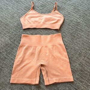 Orange workout set bra and biker shorts